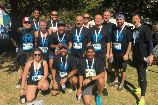 Julian at a fitness event with colleagues