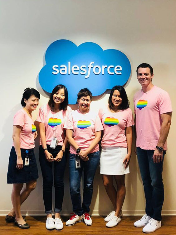 Outforce members, wearing Pink Dot T-shirts, at the Salesforce office.