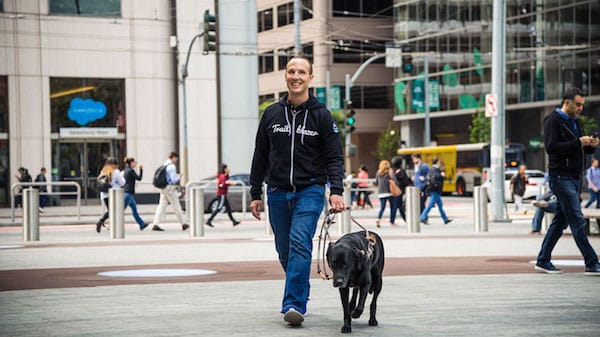 Photo of a man with a seeing-eye dog