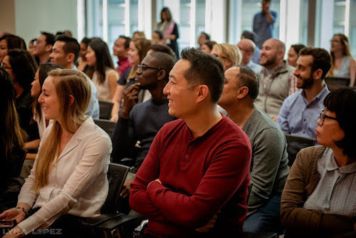 Salesforce employees listening to a panel