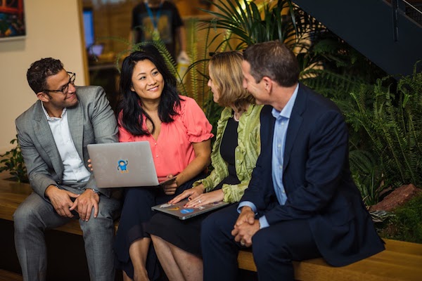 Salesforce employees engaged in a meeting