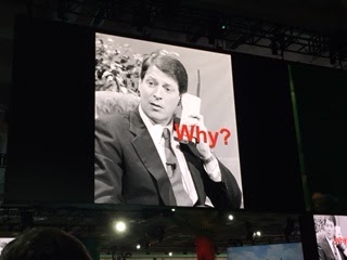 Photo of Al Gore from the 1980s on an early model mobile phone