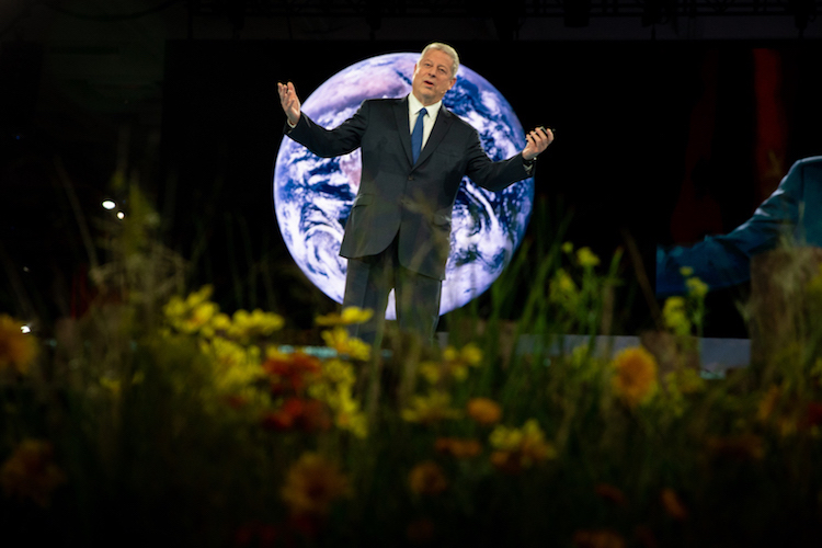 Al Gore on stage at Dreamforce '18 with a life-size globe as his backdrop