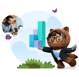 Astro holding graph blocks with a man on the computer in the background.