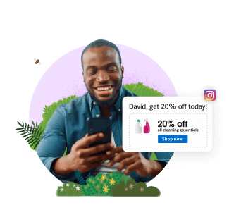 A consumer smiles as he looks at his mobile phone.