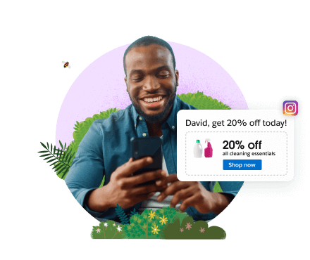 A consumer smiles as he looks at his mobile phone.