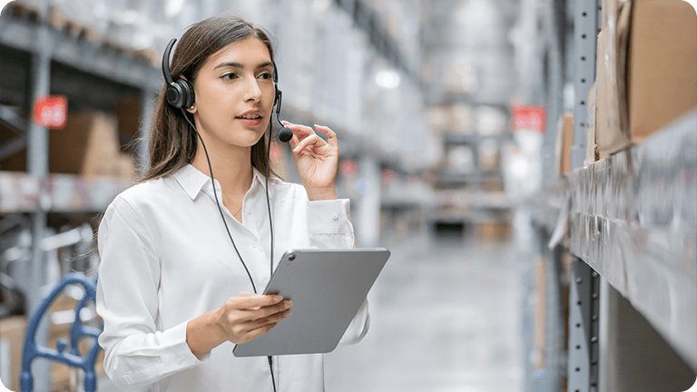 A B2B customer on a tablet in a warehouse