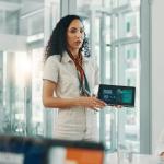 Women in a boardroom discussing AI revolution, workforce automation, and machine learning strategies.