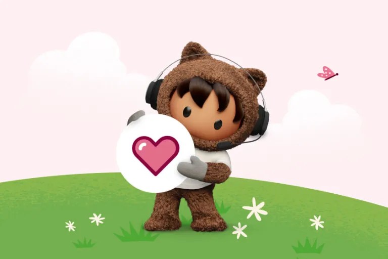 Salesforce Astro wearing a headset and holding a circular icon with a pink heart in a grassy field.