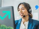Sales rep leading a sales call while looking at her computer: sales statistics