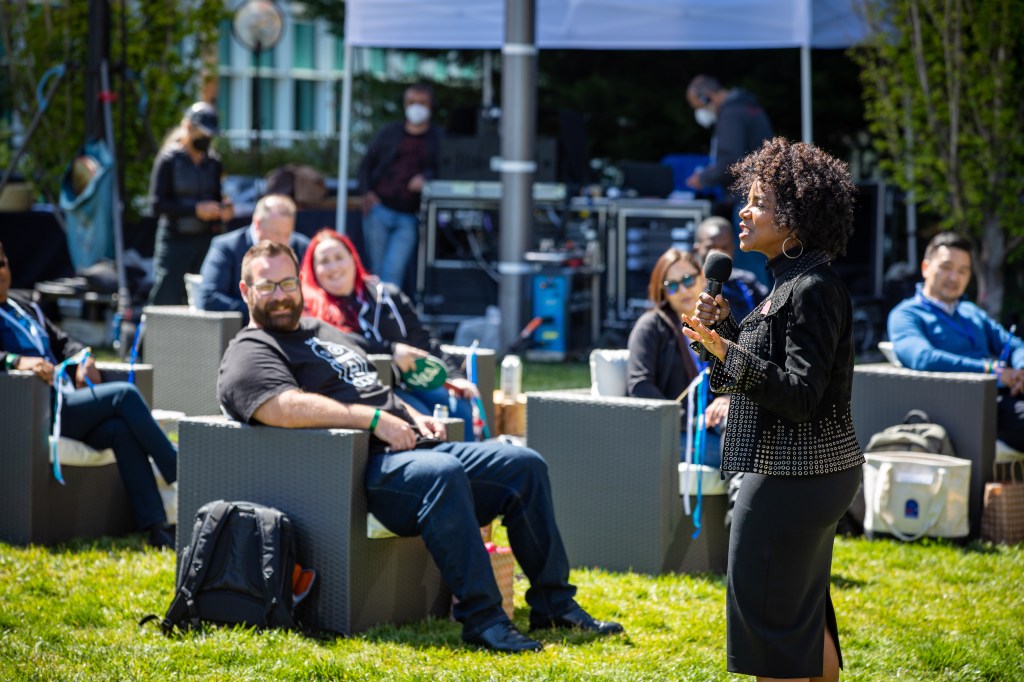 Leah McGowan Hare hosting TrailheaDX in front of an audience