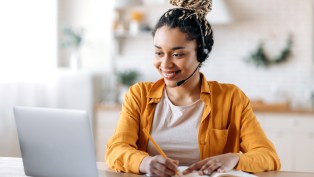 Call centre representitive smiling on phone
