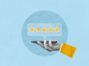 A five star review shown by a hand holding a phone on blue background.