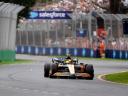 Formula 1 race car drives past Salesforce trackside signage. / customer loyalty