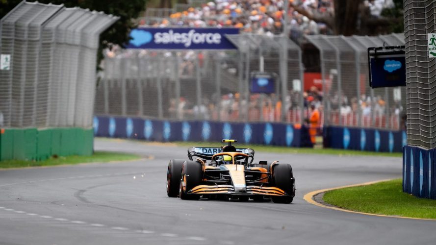 Formula 1 race car drives past Salesforce trackside signage. / customer loyalty