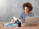 Woman reading about small business myths debunked from Salesforce trends report