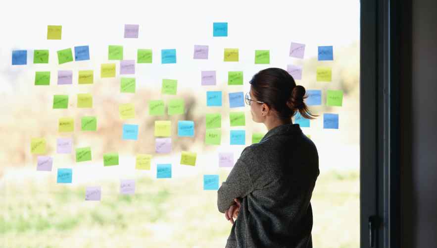 Woman views ideation board