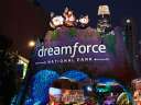 night time shot of welcome arch at dreamforce with Salesforce Tower in background