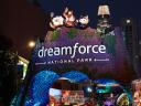 night time shot of welcome arch at dreamforce with Salesforce Tower in background