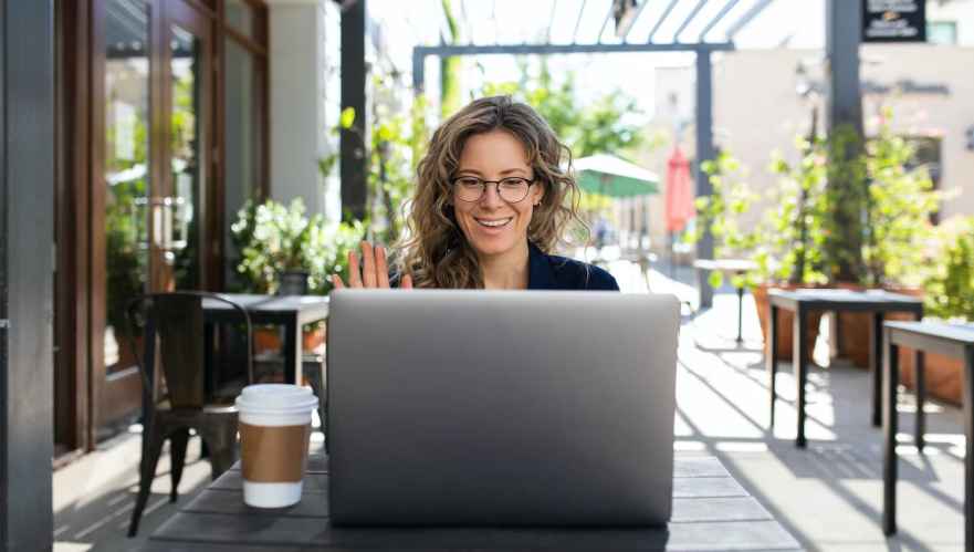 Smiling woman using a computer