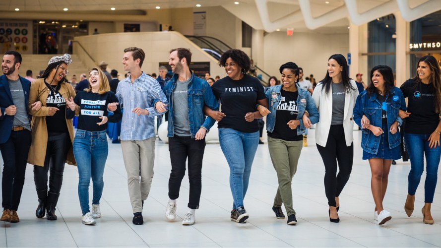 diverse set of Salesforce employees linking arms