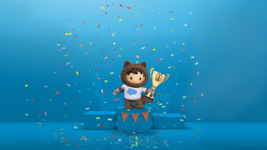 Salesforce character Astro stands atop a podium, holding a trophy and celebrating the Marketing Champions