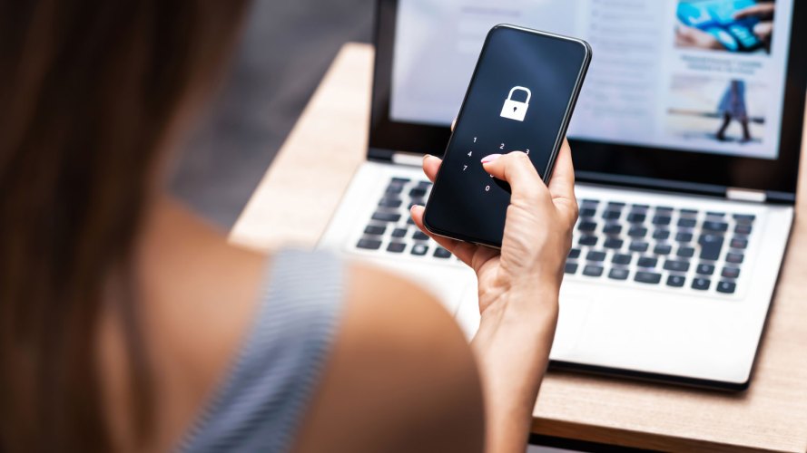 woman using 2FA from her phone - cybersecurity best practices, secure data