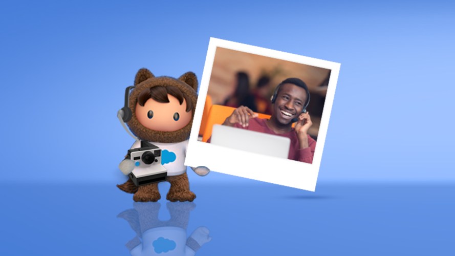 Salesforce character Astro holding photo of smiling man talking on his cell phone