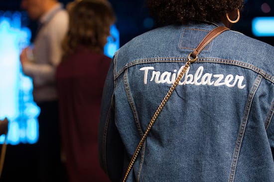 A denim jacket with "Trailblazer" embroidered on the back