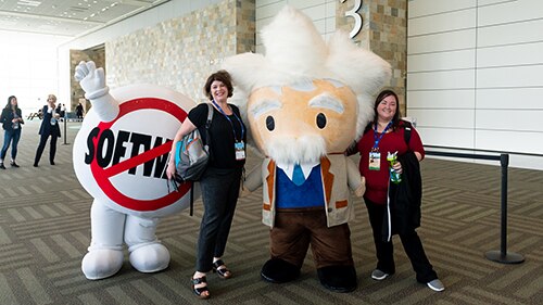 Connections '18 attendees take a photo with Salesforce's SaaSy and Einstein
