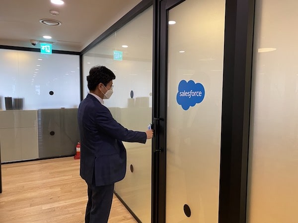 Salesforce employee enters the workspace