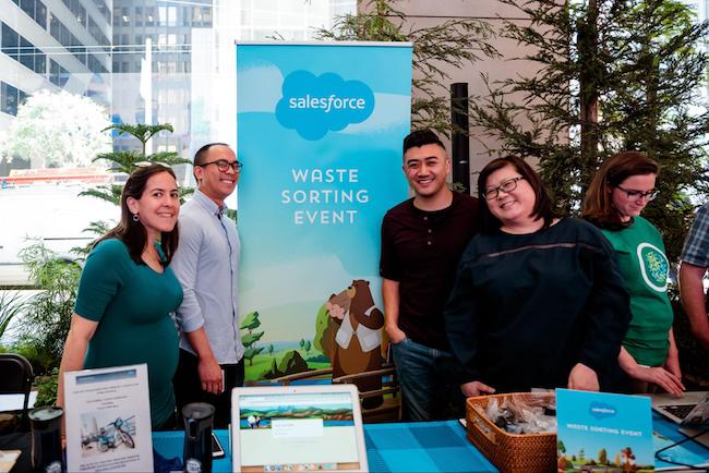 Earthforce volunteers set up an onsite information table and answer questions about waste sorting