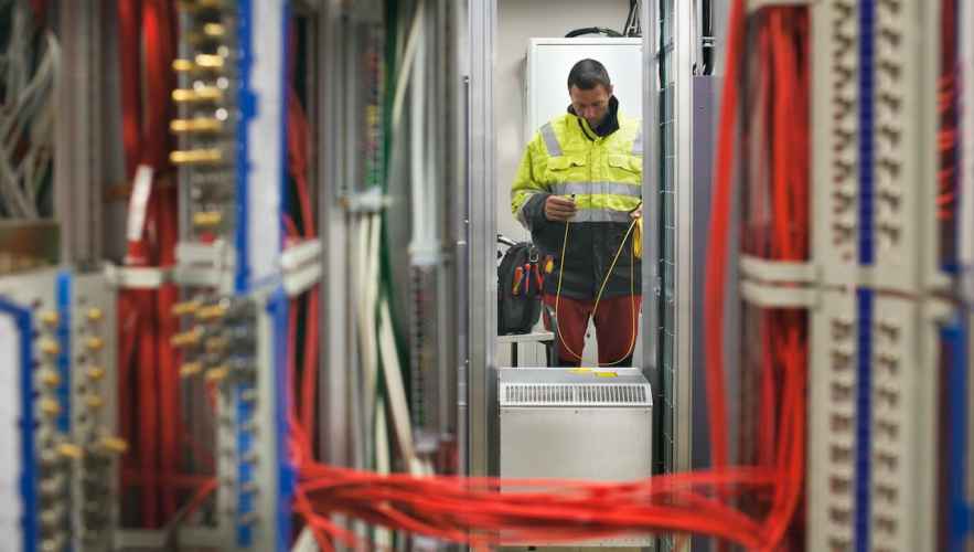 A worker doing calculations among mainframe data servers