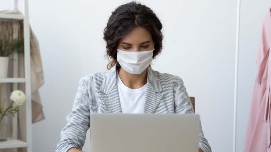 woman in mask on laptop computer responsible marketing principles