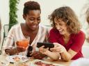 Friends chat over drinks and snacks
