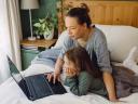 Mother and daughter viewing a laptop