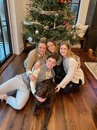 Lori’s four children and their family dog.