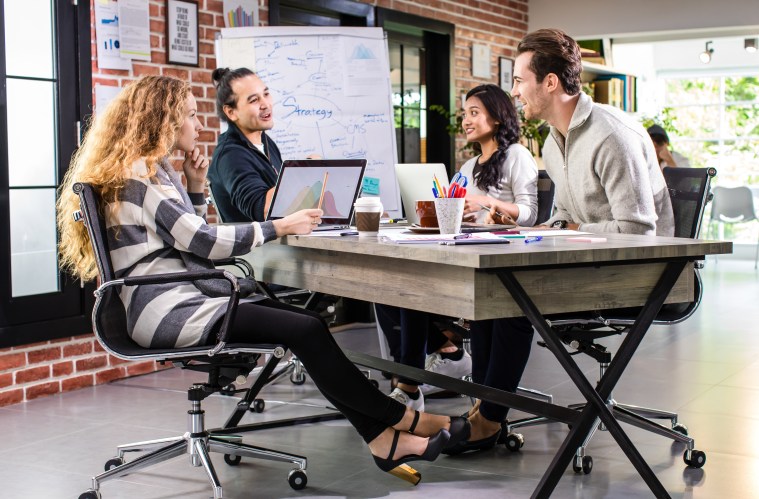 Mixed races teamwork business casual colleagues discussing marketing strategy for successful sales, planning creative ideas and projects in comfortable office.