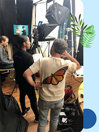 Vatora (center) filming and producing.