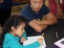 Girl with Salesforce employee volunteer at Boys & Girls Club, SF corporate social responsibility