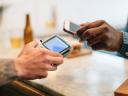 person buying lunch with their mobile wallet on a cell phone