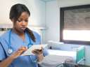 Female doctor looking a tablet - healthcare technology