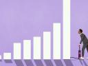 An illustration of a man using a Slack-branded air pump to expand the bars on a bar graph.