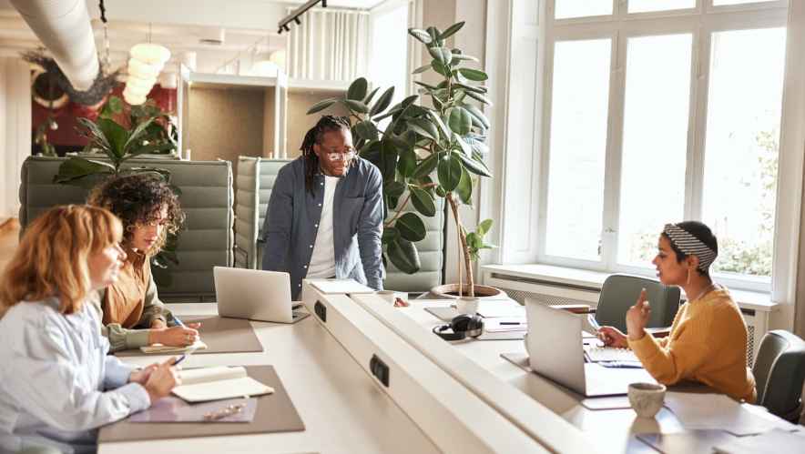 People sitting around a conference table in an office