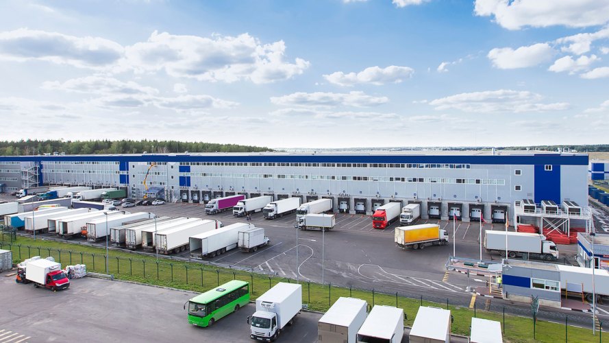 trucks at a logistics facility sustainable supplier relationships