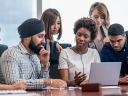 Diverse team of employees sitting at a table