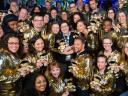 A photo taken from above of a group of 30+ Trailblazers all sporting their Salesforce Golden Hoodies.