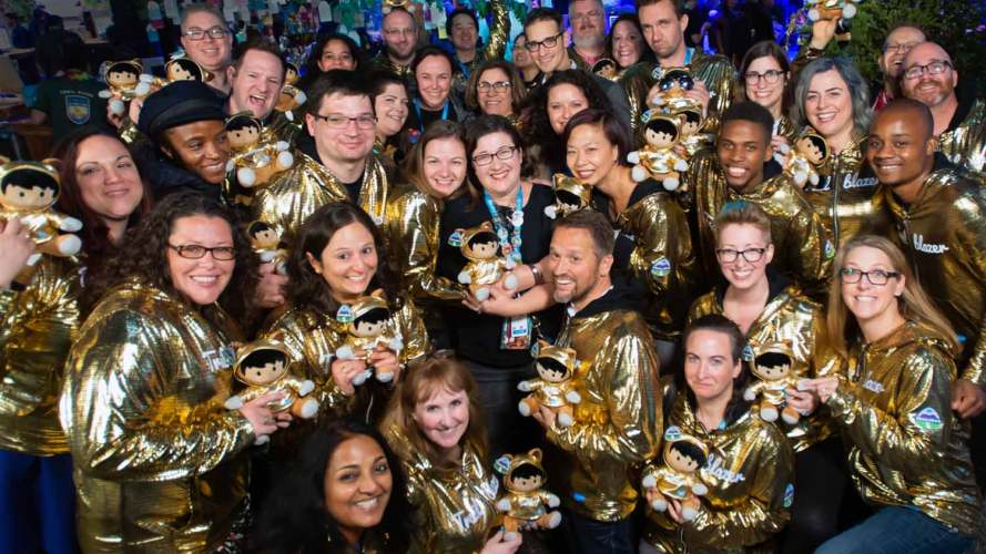 A photo taken from above of a group of 30+ Trailblazers all sporting their Salesforce Golden Hoodies.