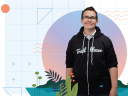 An architect Trailblazer standing in a black hoodie against a technical drawing background
