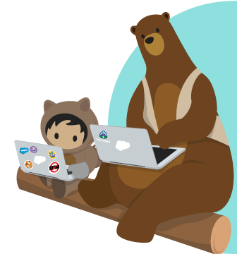 Astro and Codey sat on a log working on laptops